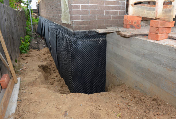 SJ Waterproofing Pros technician performing targeted Foundation Crack Repair assessment in Eastaboga, AL